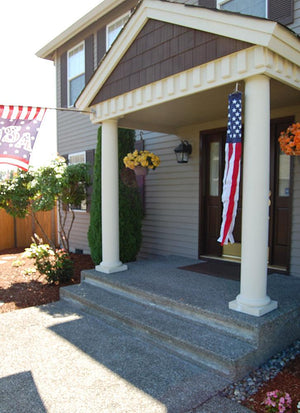 American flag windsock 121002 hanging on house