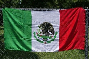 Mexican flag beach towel 084 on fence